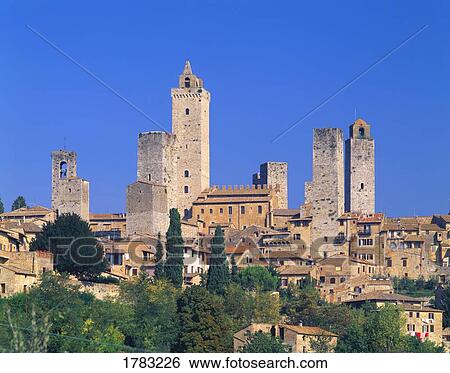 Stock Photograph - Tuscan town of San Gimignano with its mysterious towers. Fotosearch