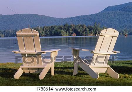 Picture - Two chairs by waterside. Fotosearch