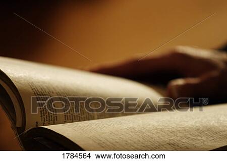 Unknown person with open Bible View Large Photo Image Picture - Unknown person with open Bible. Fotosearch