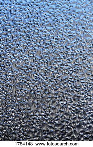 Stock Photo - Water droplets on a surface. Fotosearch