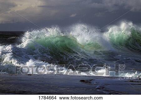 Picture - Waves crashing on Cape Kiwanda. Fotosearch