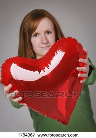 Woman giving heart View Large Photo Image Stock Photo - Woman giving heart. Fotosearch