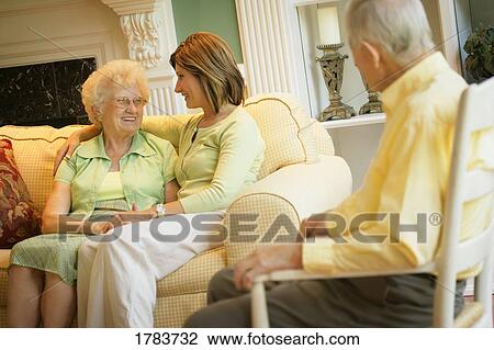 Woman visits her parents View Large Photo Image Stock Image - Woman visits her parents. Fotosearch