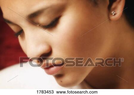 Stock Image - Woman with eyes closed. Fotosearch