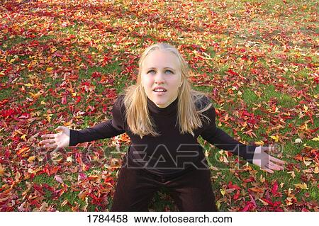 Woman with outstretched arms kneeling View Large Photo Image Stock Photo - Woman with outstretched arms kneeling. Fotosearch