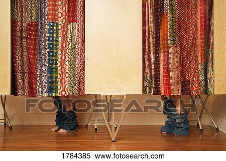 Women trying on clothes View Large Photo Image Stock Photography - Women trying on clothes. Fotosearch