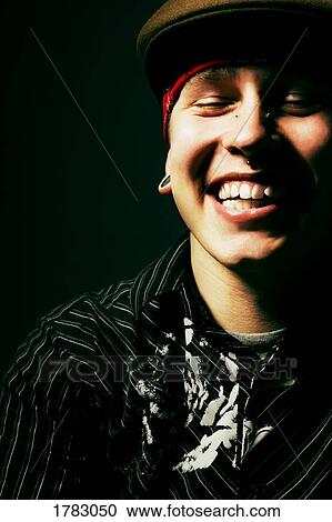 Stock Image - Young man laughing. Fotosearch