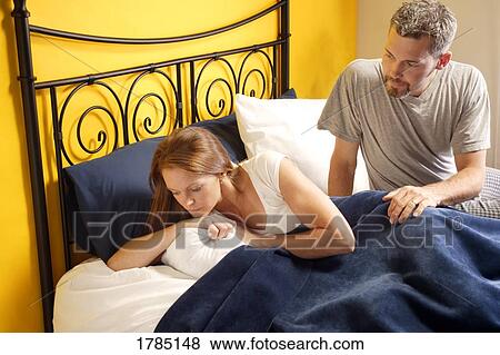 A husband attending to his upset wife. View Large Photo Image Stock Photo - A husband attending to his upset wife.. Fotosearch