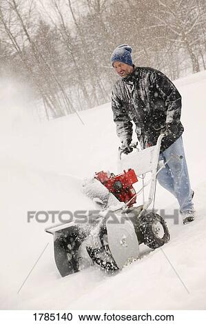 A man snow-blowing View Large Photo Image Stock Image - A man snow-blowing. Fotosearch