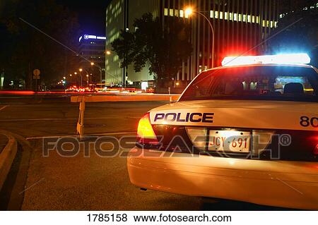 A police car on duty during the night. View Large Photo Image Stock Photo - A police car on duty during the night.. Fotosearch