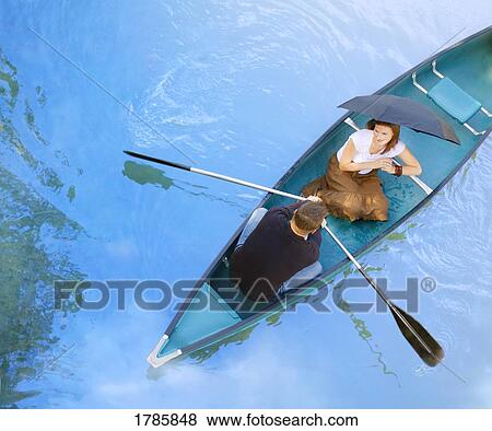 A romantic outing in a canoe View Large Photo Image Stock Photo - A romantic outing in a canoe. Fotosearch