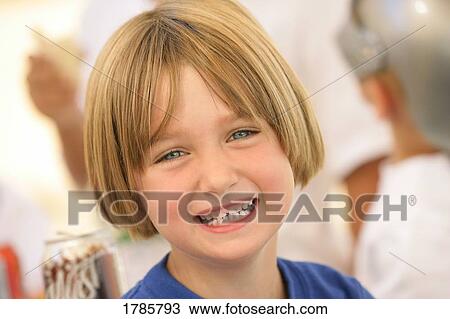 Stock Image - A smiling young girl. Fotosearch