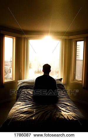 Stock Photo - Alone in bedroom. Fotosearch