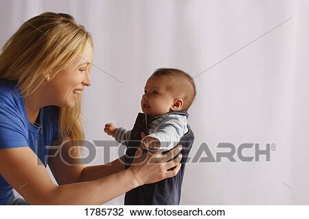 Attentive mother View Large Photo Image Stock Image - Attentive mother. Fotosearch