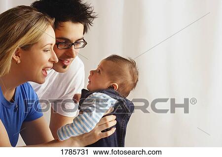 Attentive parents View Large Photo Image Stock Image - Attentive parents. Fotosearch