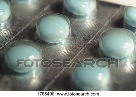 Stock Photo - Blue pills in packaging. Fotosearch