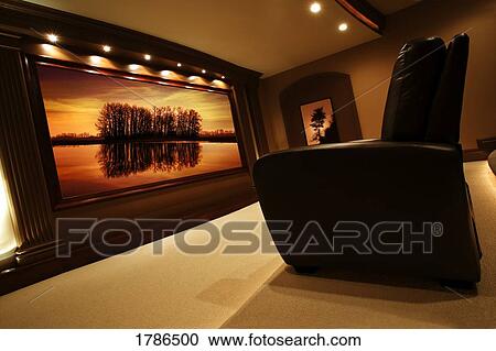 Stock Image - Chair and photograph in living room. Fotosearch