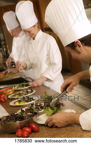 Stock Image - Chefs at work. Fotosearch