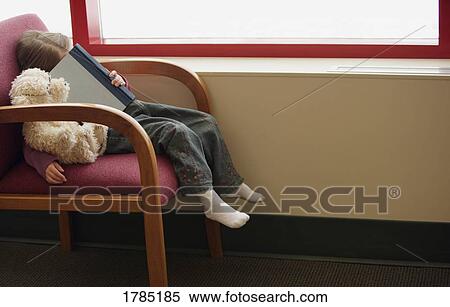 Child falls asleep reading a book View Large Photo Image Stock Photography - Child falls asleep reading a book. Fotosearch