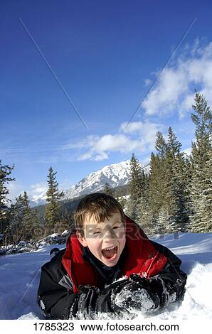 Child playing in the snow View Large Photo Image Stock Image - Child playing in the snow. Fotosearch