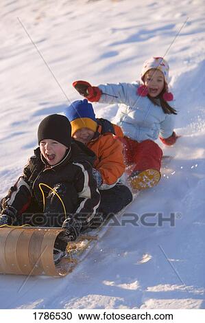 Stock Image - Children on a sled. Fotosearch