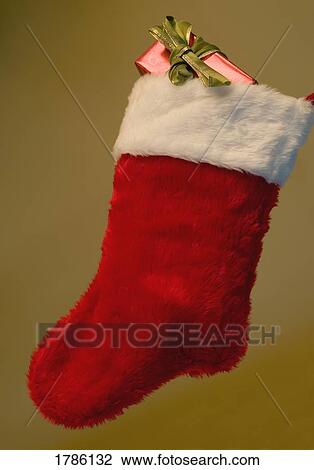 Christmas stocking with present View Large Photo Image Stock Image - Christmas stocking with present. Fotosearch