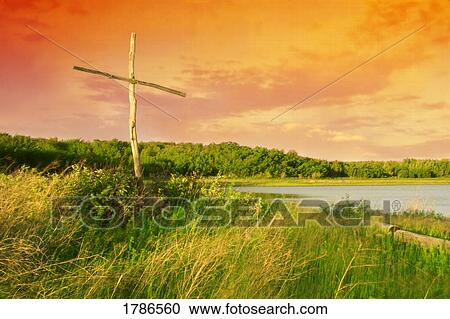 Stock Image - Cross with sunset. Fotosearch