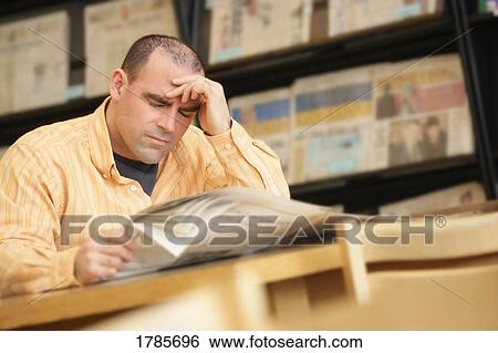 Distressed Man Reading Paper View Large Photo Image Stock Photograph - Distressed Man Reading Paper. Fotosearch