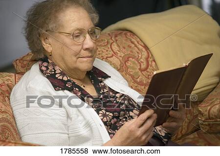 Elderly woman reading View Large Photo Image Stock Photo - Elderly woman reading. Fotosearch