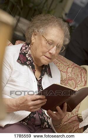 Stock Photo - Elderly woman reading. Fotosearch