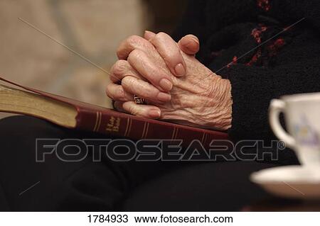 Elderly women in prayer View Large Photo Image Stock Image - Elderly women in prayer. Fotosearch