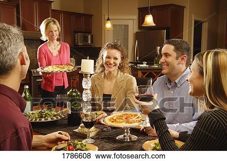 Stock Photo - Entertaining at home. Fotosearch