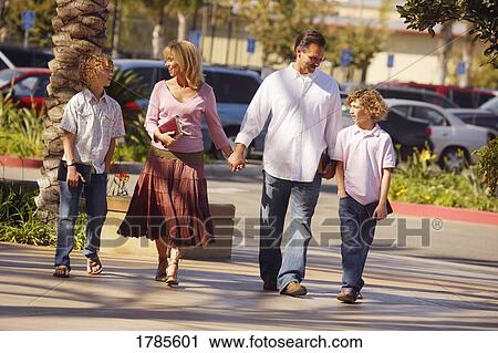 Stock Image - Family walking together. Fotosearch
