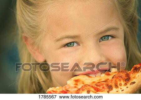 Stock Photo - Girl eating pizza. Fotosearch