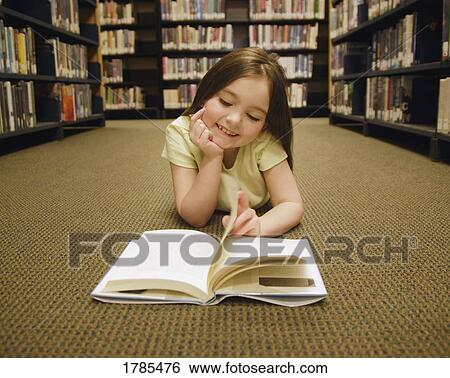 Girl reading book View Large Photo Image Stock Photograph - Girl reading book. Fotosearch