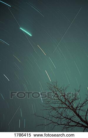 Stock Photography - Hale-Bopp comet and star streaks. Fotosearch