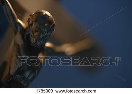Stock Photo - Jesus on cross statue. Fotosearch