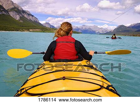 Kayakers on a mountain lake View Large Photo Image Picture - Kayakers on a mountain lake. Fotosearch
