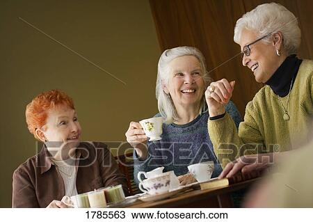 Stock Image - Ladies having coffee. Fotosearch