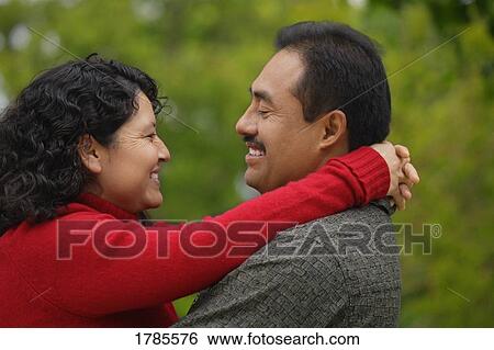 Stock Photograph - Latino couple embracing. Fotosearch