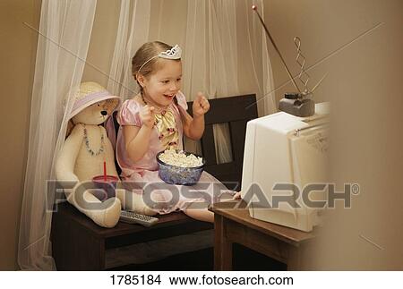 Picture - Little Princess watching television. Fotosearch