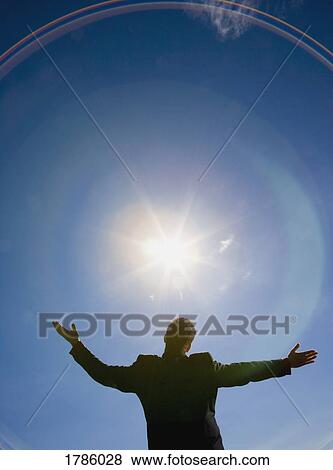 Man in suit with arms raised to the sky View Large Photo Image Stock Photo - Man in suit with arms raised to the sky. Fotosearch