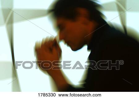 Stock Image - Man praying with motion. Fotosearch