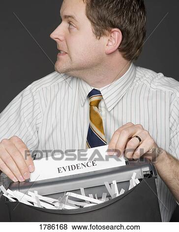Man shredding evidence View Large Photo Image Stock Photo - Man shredding evidence. Fotosearch