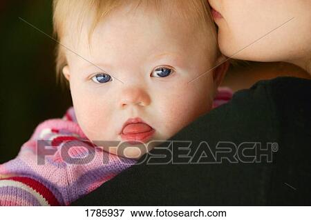 Stock Photo - Mother and down syndrome child. Fotosearch
