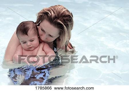 Mother and son in swimming pool View Large Photo Image Stock Photograph - Mother and son in swimming pool. Fotosearch