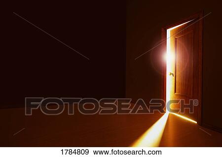 Partially opened door with bright light View Large Photo Image Stock Photo - Partially opened door with bright light. Fotosearch