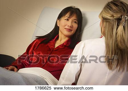 Stock Photography - Patient listening to doctor. Fotosearch