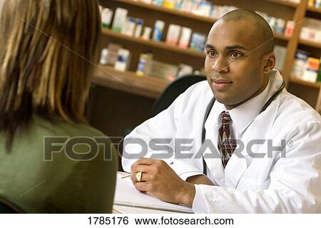 Pharmacist consultation View Large Photo Image Stock Photograph - Pharmacist consultation. Fotosearch