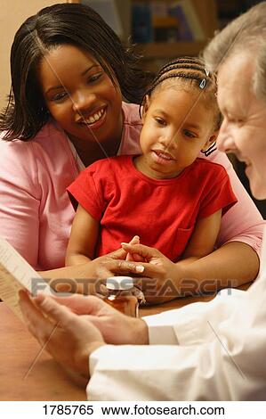 Pharmacist with customers View Large Photo Image Stock Photography - Pharmacist with customers. Fotosearch